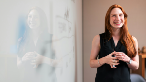 Female NDIS Support Coordinator smiling. 